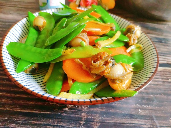 荷蘭豆炒螺肉的做法-家常味炒菜譜-易網(wǎng)健康養(yǎng)生網(wǎng) 荷蘭豆炒螺肉的做法-家常味炒菜譜